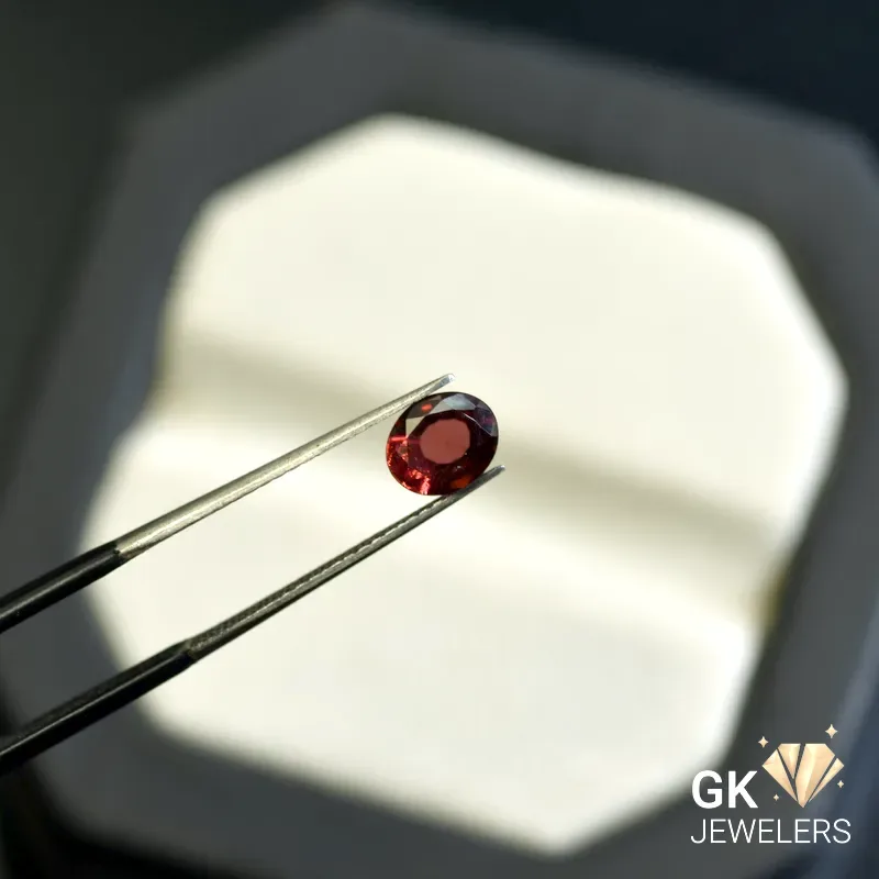 natural almandine garnet 1.27ct red oval stone, GK Jewelers Pakistan authentic gemstone photo