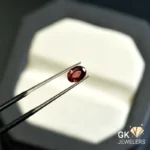 natural almandine garnet 1.09ct red oval stone - GK Jewelers Pakistan authentic gemstone photo