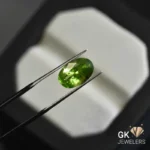 natural peridot 3.93ct green oval stone, GK Jewelers Pakistan authentic gemstone photo