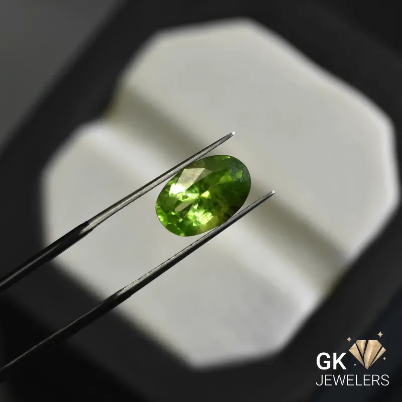 natural peridot 3.93ct green oval stone, GK Jewelers Pakistan authentic gemstone photo
