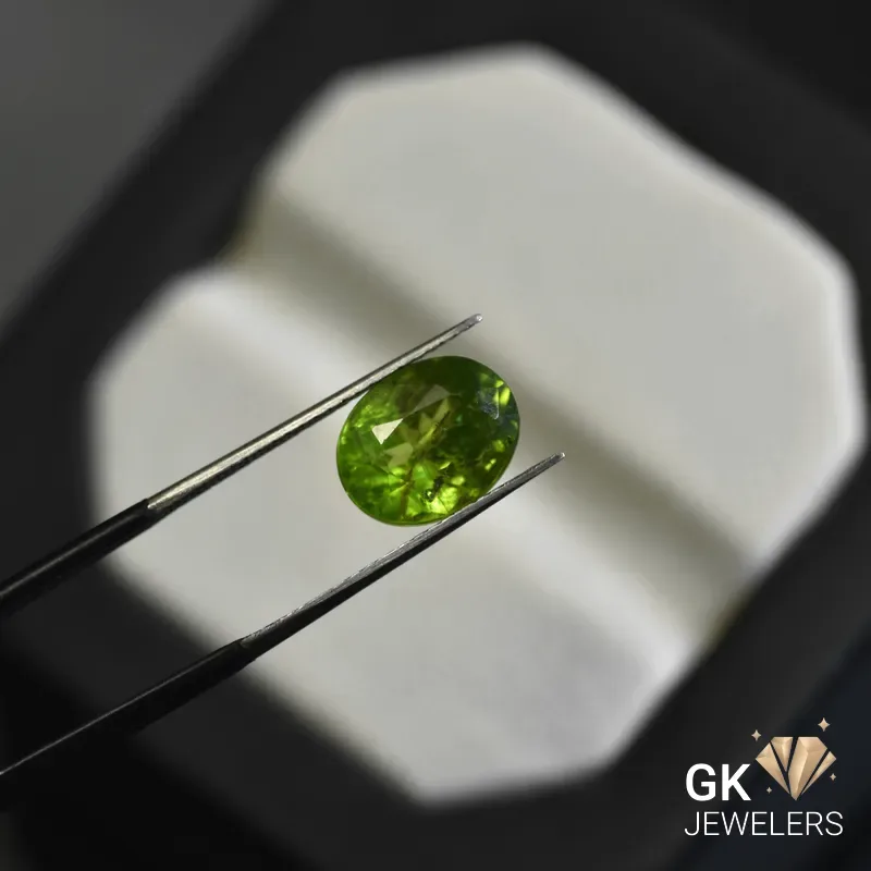 natural peridot 4.73ct green oval stone, GK Jewelers Pakistan authentic gemstone photo