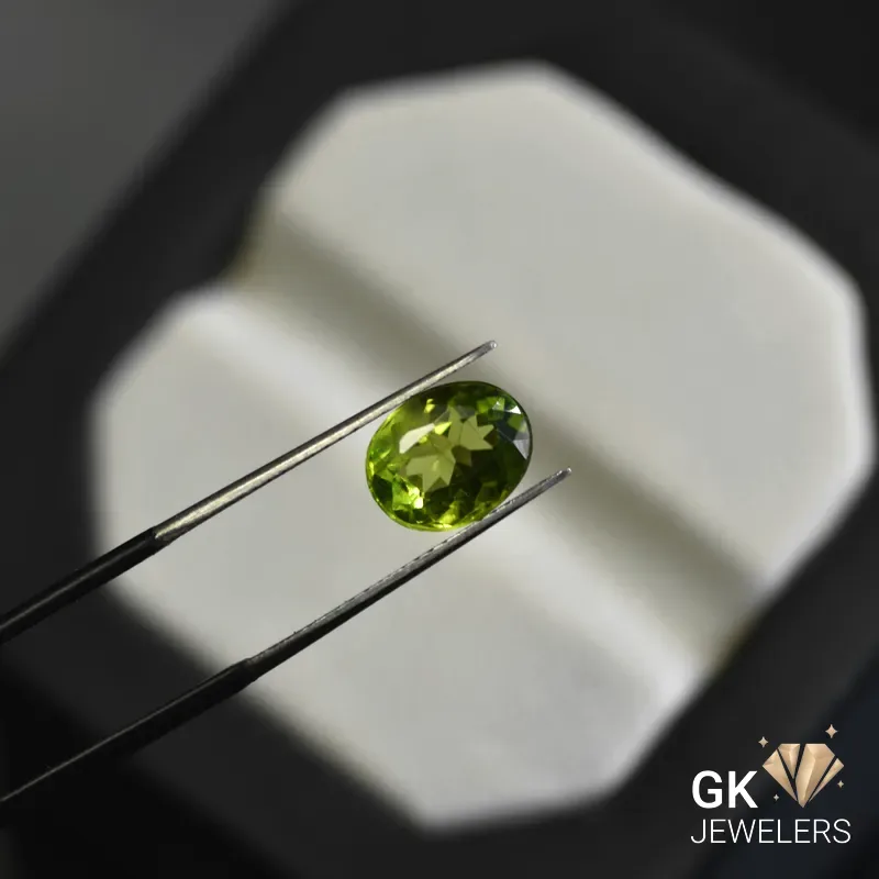 natural peridot 2.92ct green oval stone, GK Jewelers Pakistan authentic gemstone photo
