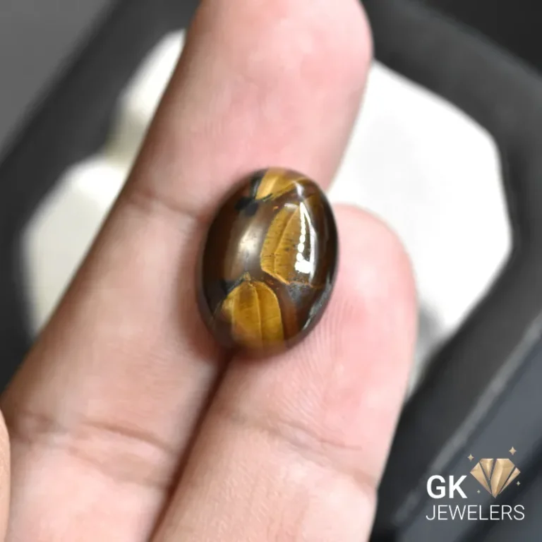 natural tiger eye 12.27ct brown oval stone, GK Jewelers Pakistan authentic gemstone photo