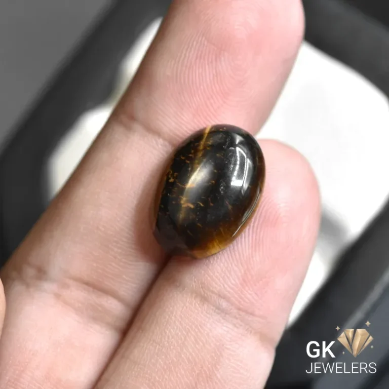 natural tiger eye 11.48ct black oval stone, GK Jewelers Pakistan authentic gemstone photo