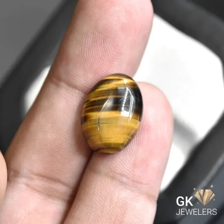 natural tiger eye 10.96ct brown oval stone, GK Jewelers Pakistan authentic gemstone photo