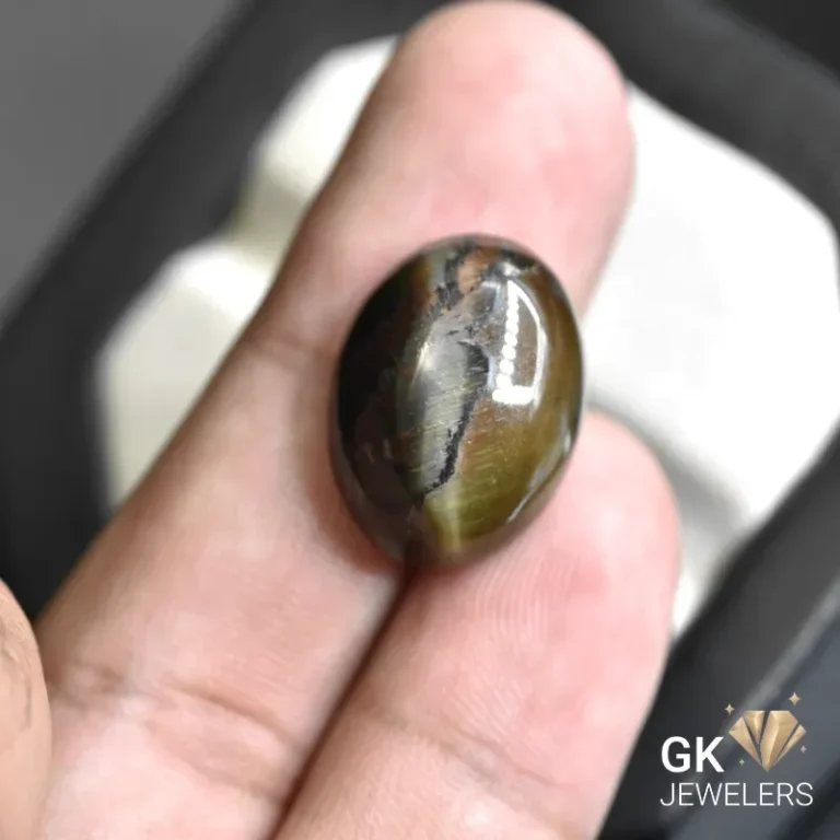 natural tiger eye 22.69ct black oval stone, GK Jewelers Pakistan authentic gemstone photo