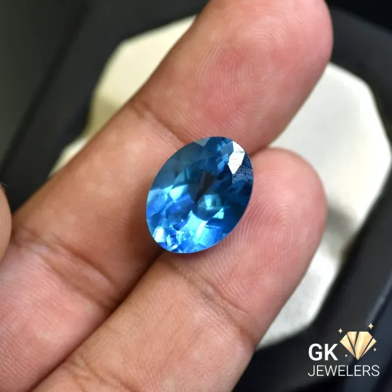 natural topaz 11.51ct blue oval stone, GK Jewelers Pakistan authentic gemstone photo
