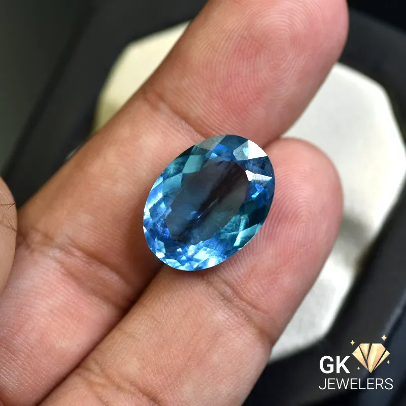 natural topaz 15.11ct blue oval stone, GK Jewelers Pakistan authentic gemstone photo