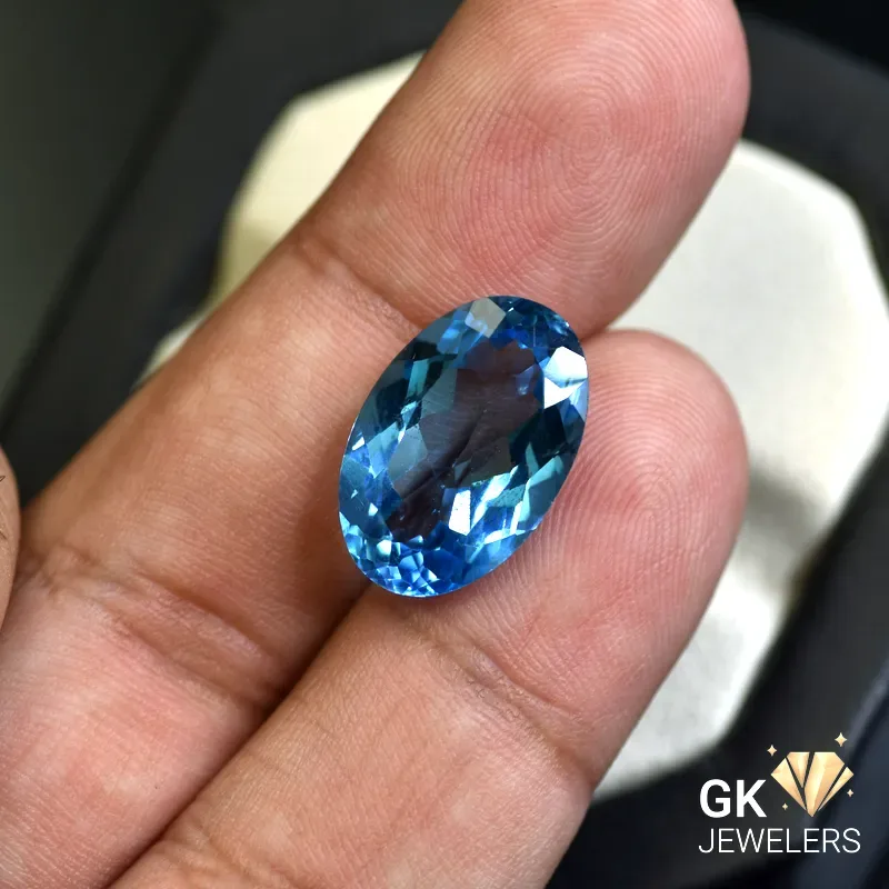 natural topaz 11.92ct blue oval stone, GK Jewelers Pakistan authentic gemstone photo