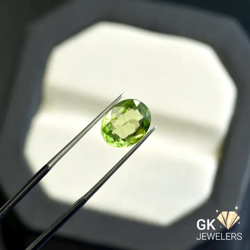 natural peridot 3.24ct green oval stone, GK Jewelers Pakistan authentic gemstone photo