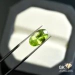 natural peridot 5.11ct green oval stone: GK Jewelers Pakistan authentic gemstone photo