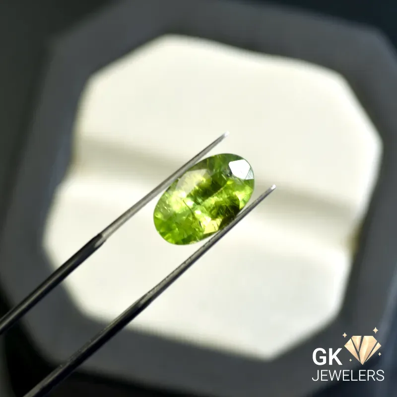 natural peridot 5.11ct green oval stone: GK Jewelers Pakistan authentic gemstone photo