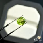 synthetic peridot 3.96ct green oval stone, GK Jewelers Pakistan authentic gemstone photo