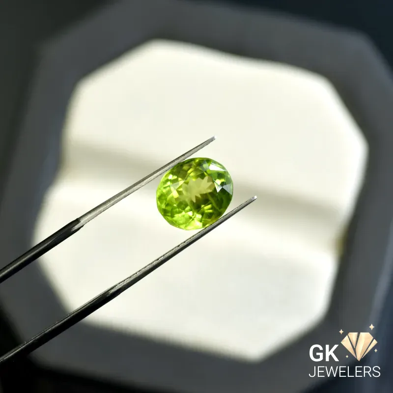 synthetic peridot 3.96ct green oval stone, GK Jewelers Pakistan authentic gemstone photo