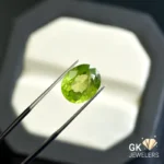 natural peridot 5.76ct green oval stone - GK Jewelers Pakistan authentic gemstone photo