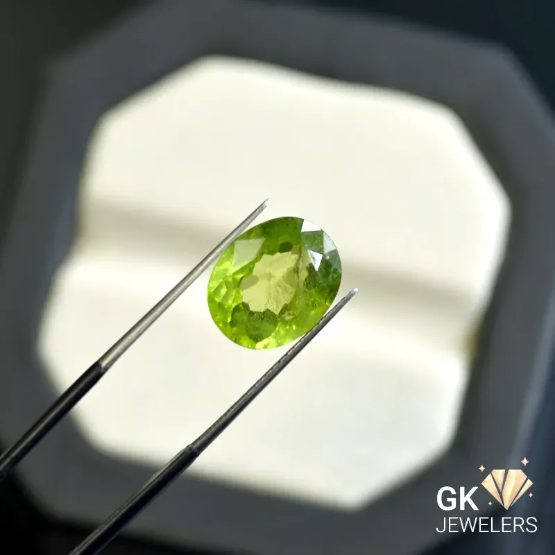 natural peridot 5.76ct green oval stone - GK Jewelers Pakistan authentic gemstone photo