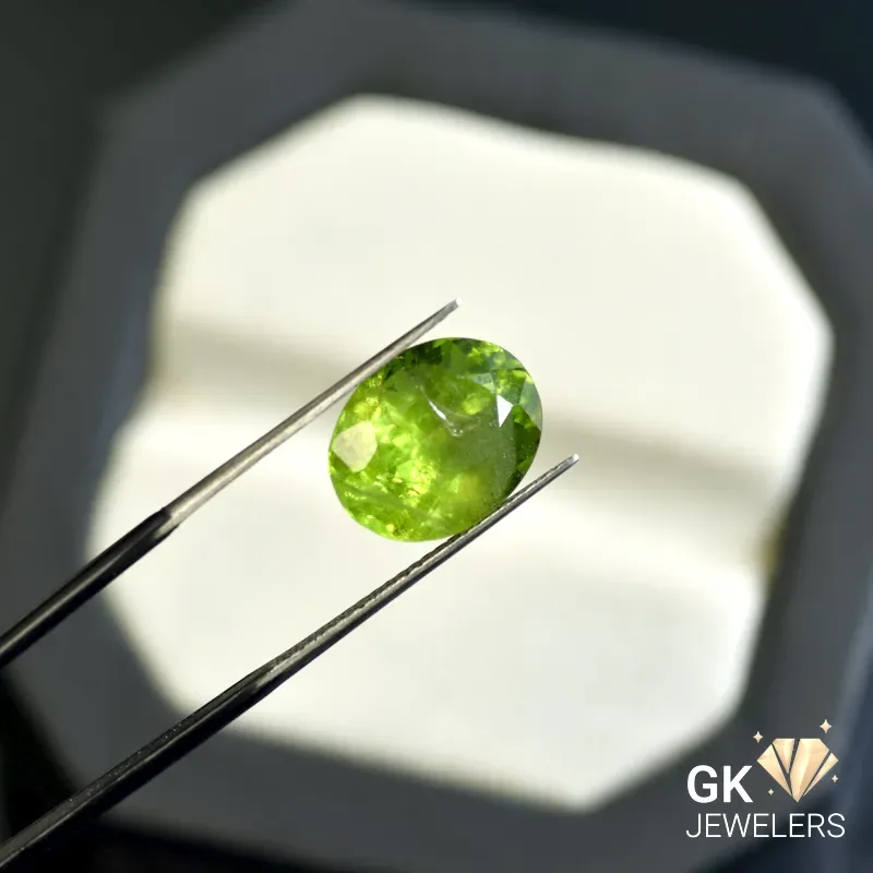 natural peridot 6.68ct green oval stone, GK Jewelers Pakistan authentic gemstone photo