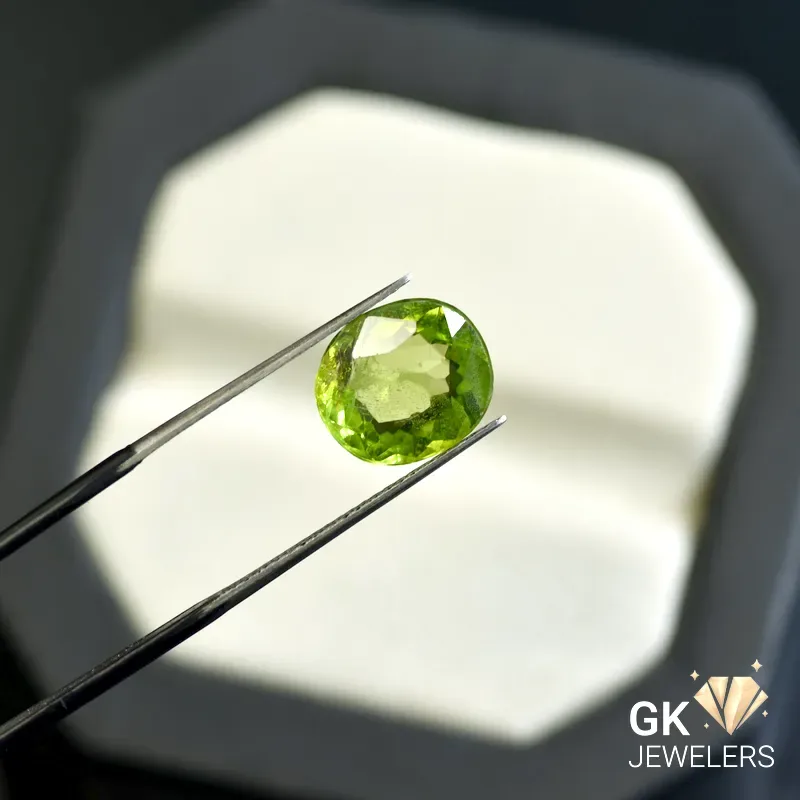 natural peridot 4.53ct green cushion stone, GK Jewelers Pakistan authentic gemstone photo